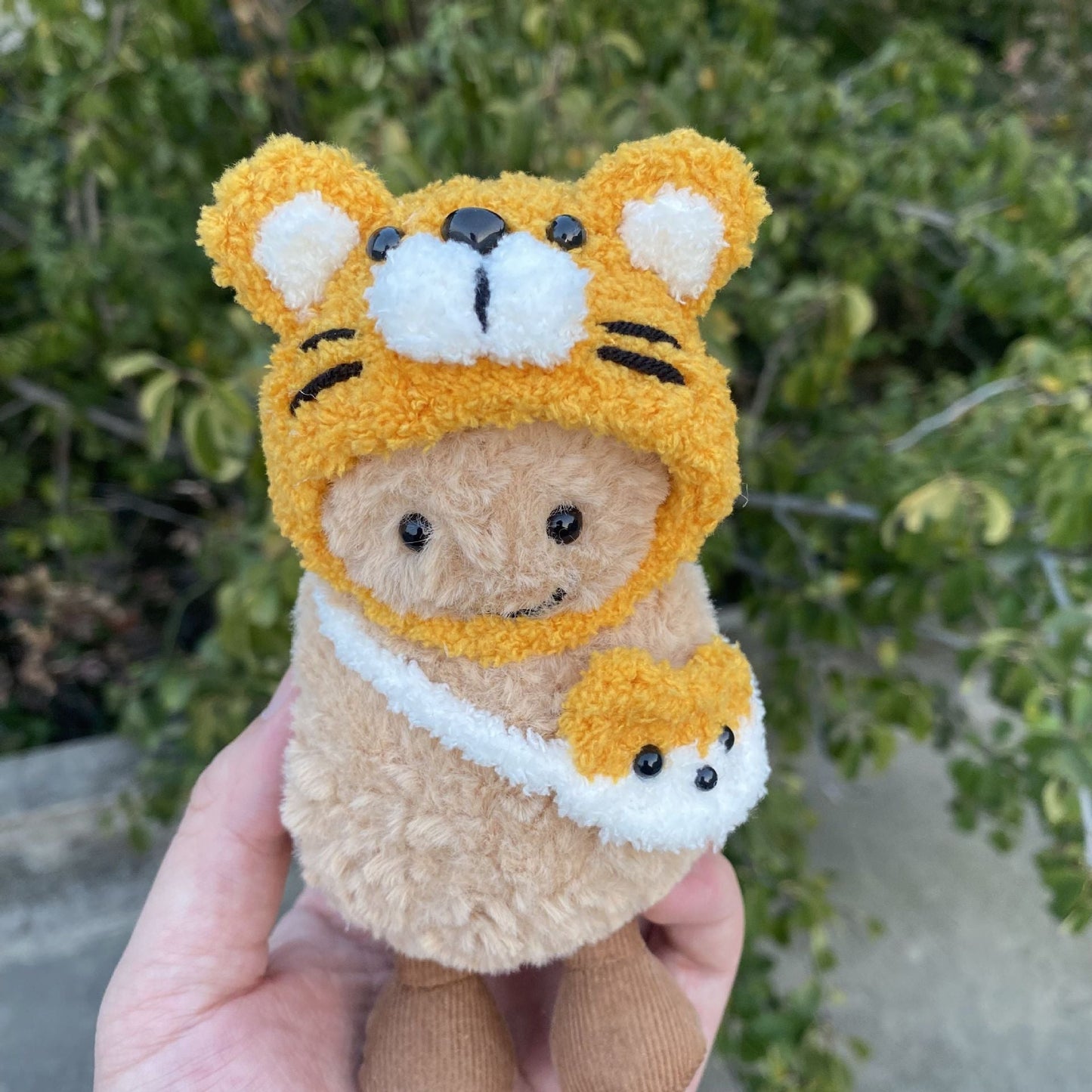 Tiger Hood Costume on 15cm plush doll: golden-yellow tiger hood with embroidered black stripes, white inner ear and muzzle...