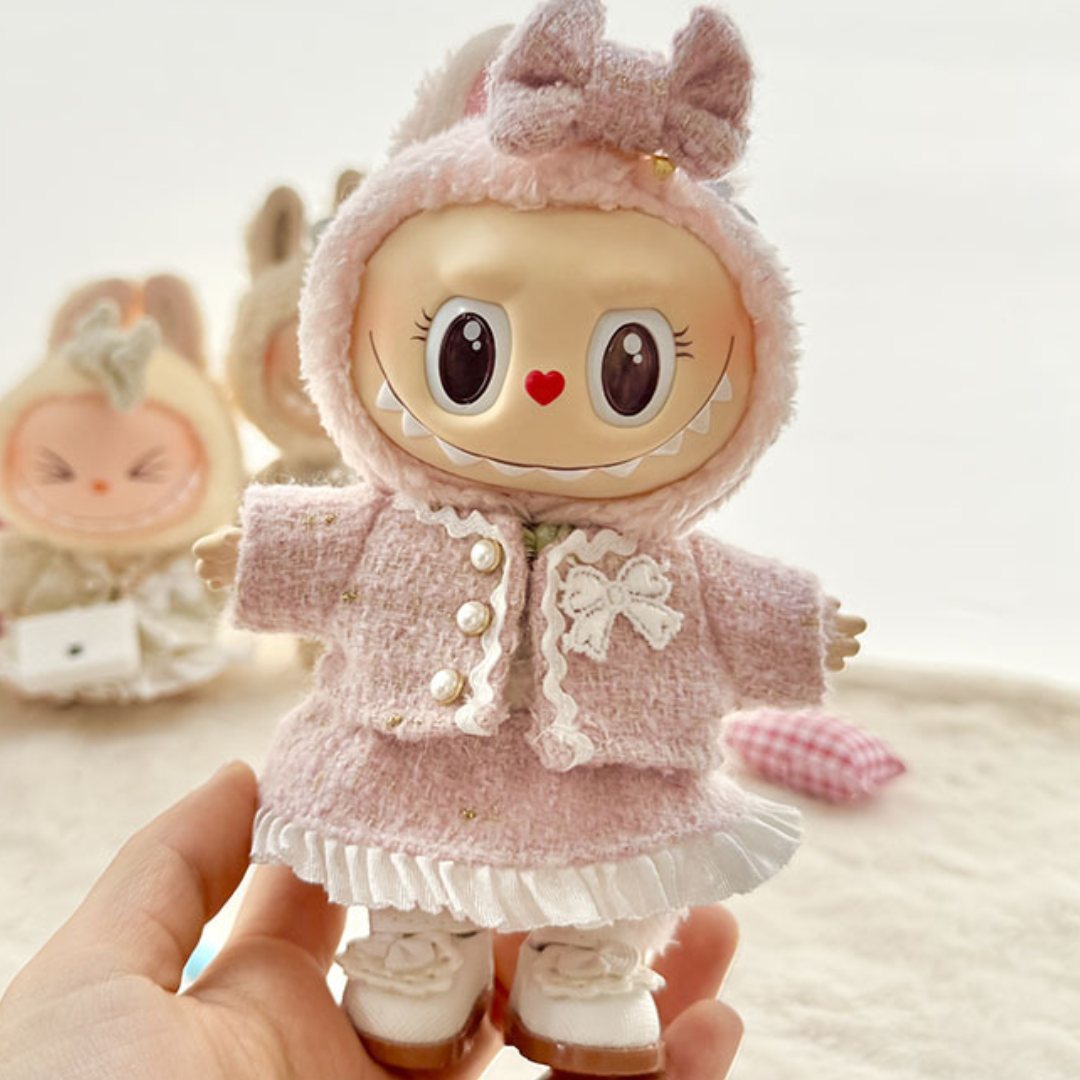 Sweet Pink Tweed Outfit on 17cm plush doll: pink tweed jacket with pearl-style buttons, white lace bow applique on front.