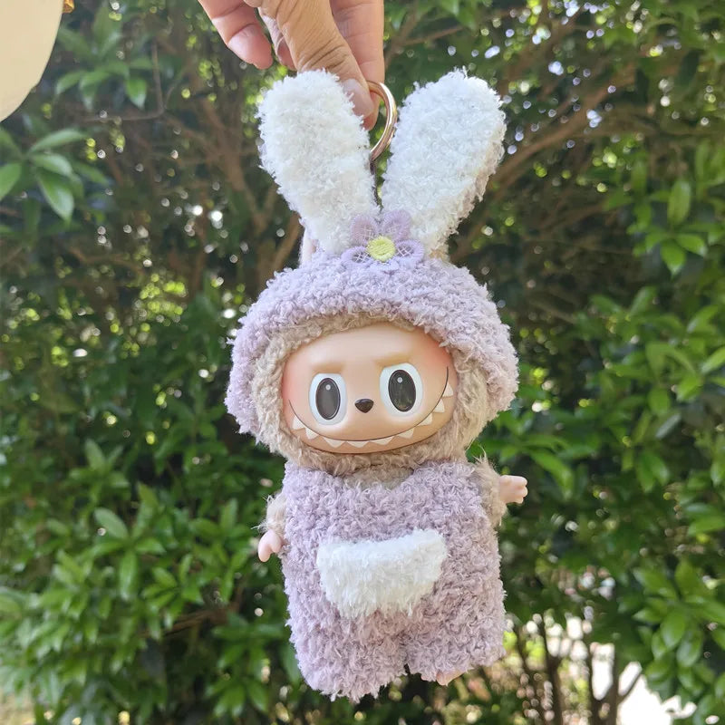 Lilac Bunny Hoodie Outfit on 17cm plush doll: lilac sherpa bunny hoodie onesie with oversized floppy ears, front kangaroo-...