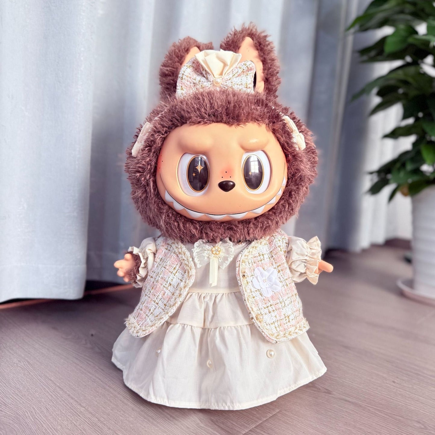 Cream Tweed Set on 58cm plush doll: cream and pastel tweed open-front jacket, white cotton dress with pearl button detail.