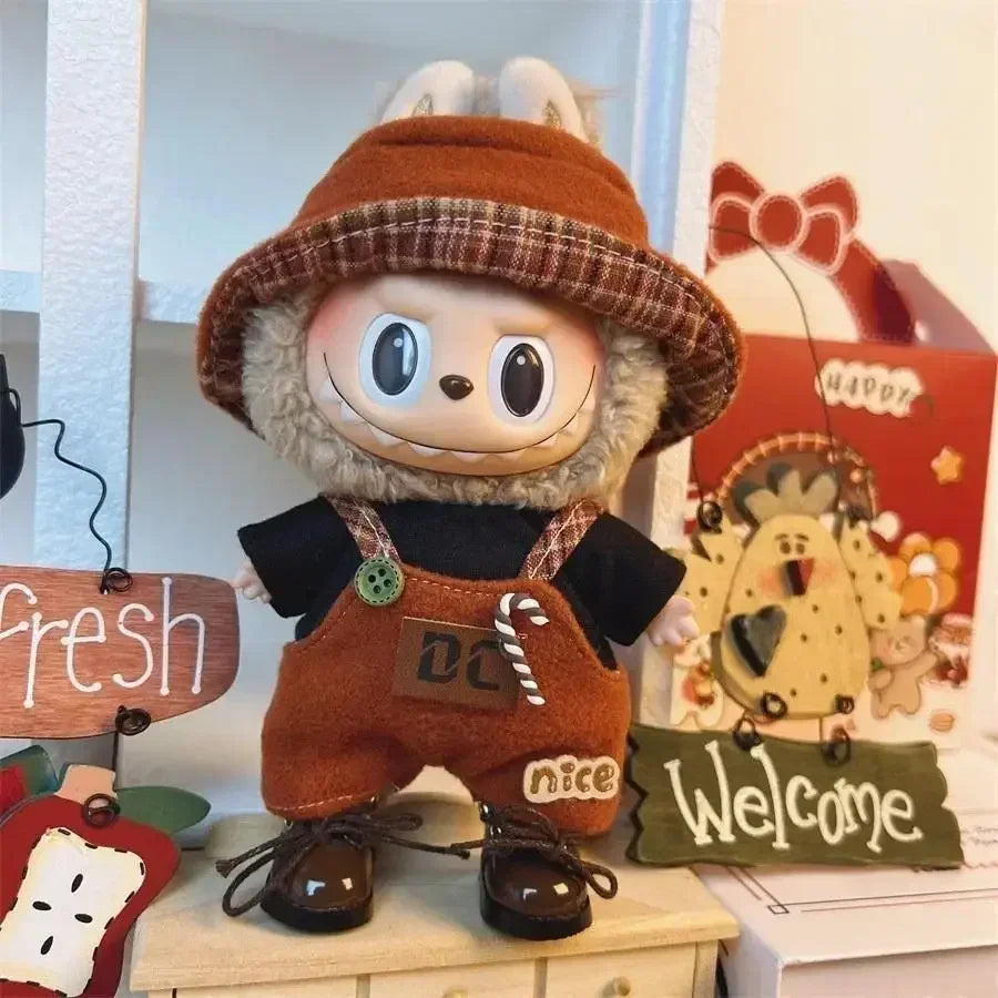 Brown Jumpsuit on 17cm plush doll: brown jumpsuit with embroidered details, black long-sleeve undershirt.