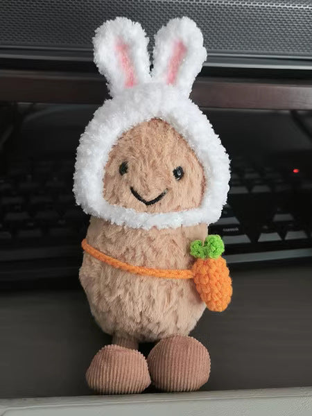 Bunny Hood with Accessory on 31cm plush rabbit: white fluffy bunny hood with soft pink-lined upright ears, bright orange c...