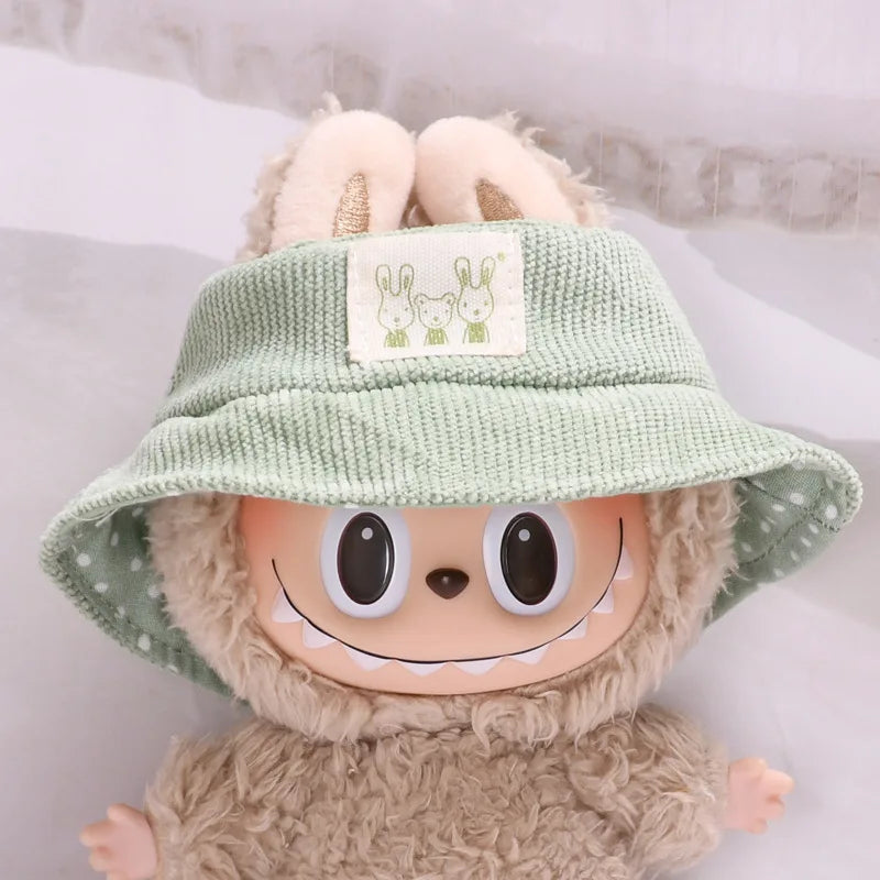 Sage Corduroy Hat on 17cm plush doll: sage green corduroy bucket hat, green and white polka-dot brim lining.