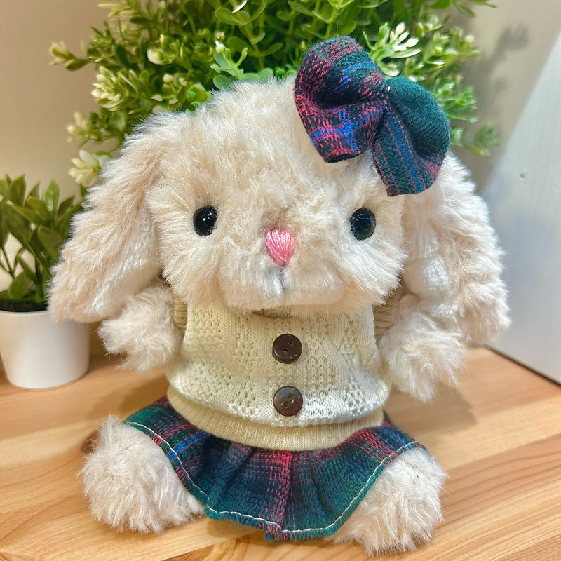 Tartan Set on 31cm plush rabbit: cream cable-knit sweater vest with brown button details, green and pink tartan plaid skirt.