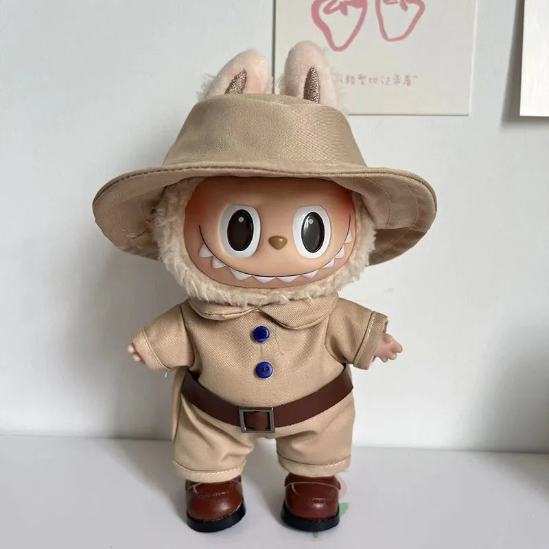 Safari Explorer Outfit on 17cm plush doll: khaki cotton explorer jumpsuit with navy blue buttons, brown faux-leather belt...