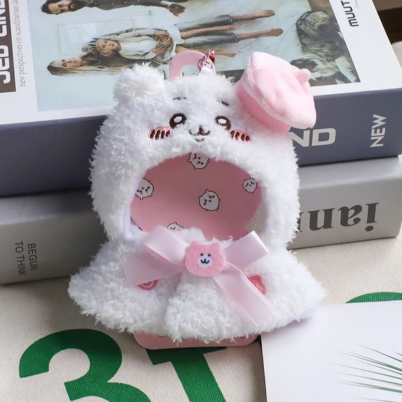 Pinky Paris Outfit on 17cm plush doll: white sherpa cape with bunny-ear hood, pink bear-print inner dress/bib.