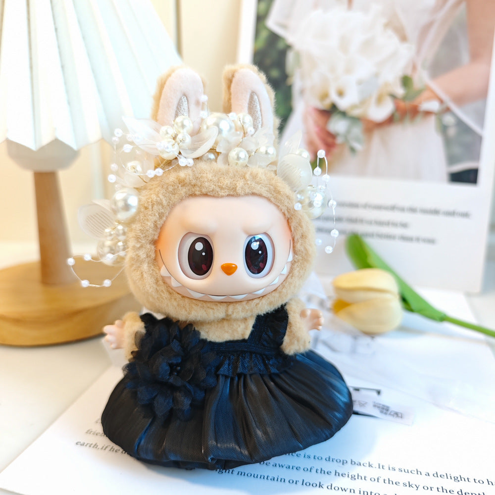 Satin and Dress on 17cm plush doll: black satin and tulle ruffled dress, pearl and crystal bead headpiece.