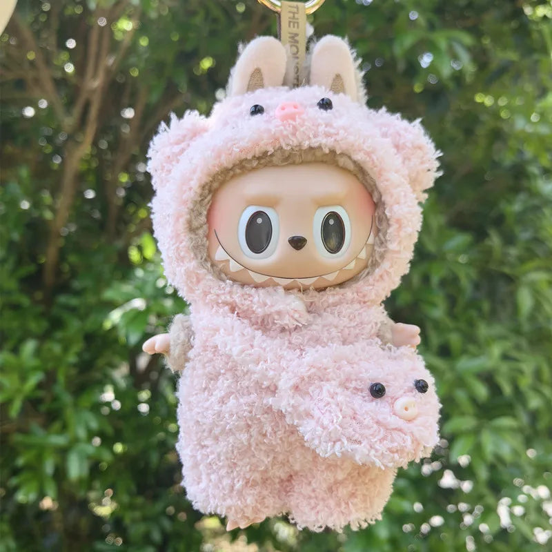 Pink Piggy Plush Costume on 17cm plush doll: full-body blush pink sherpa piggy onesie with hood, piggy ears and snout deta...