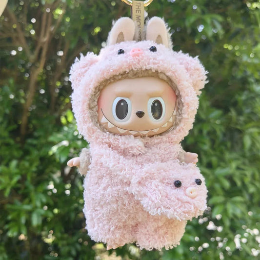Pink Piggy Plush Costume on 17cm plush doll: full-body blush pink sherpa piggy onesie with hood, piggy ears and snout deta...