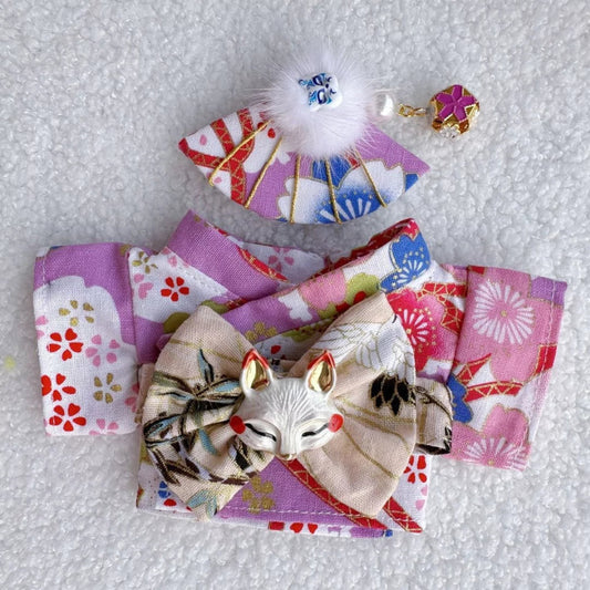 Japanese Kimono Outfit on 17cm plush doll: multi-panel kimono in purple, pink, and floral printed fabrics, decorative obi...