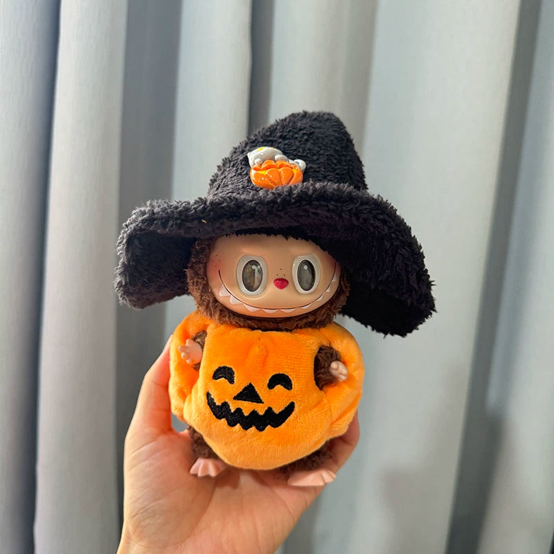 Halloween Pumpkin Outfit on 17cm plush doll: orange pumpkin body suit with jack-o'-lantern face, black fuzzy oversized wit...