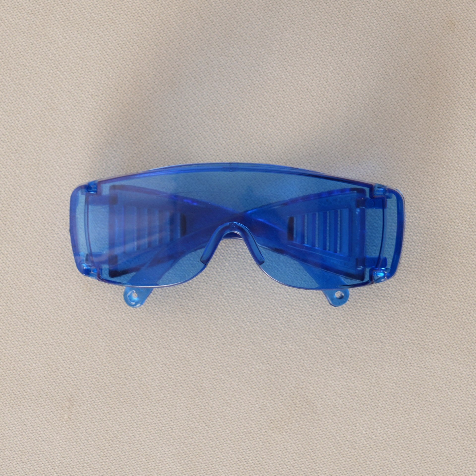 Futuristic Blue Sunglasses on 17cm plush doll: pair of futuristic wraparound sunglasses, color: translucent cobalt blue.