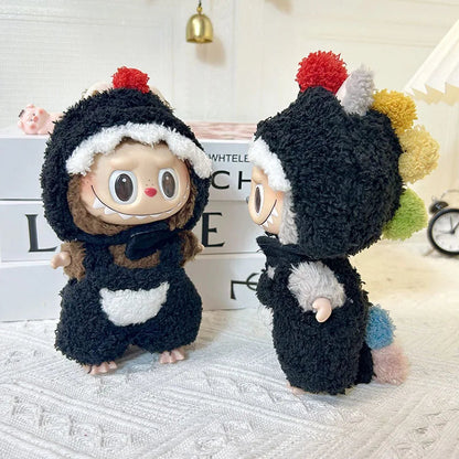 Pom Pom Costume on 17cm plush doll: full-body black sherpa dino onesie with hood, red and multicolor yarn pom pom spines a...