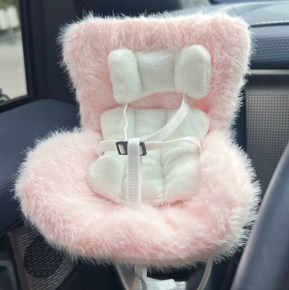 Fluffy Pink Faux Accessory on 17cm plush doll: fluffy pink mini car seat, built-in adjustable seatbelt with buckle.