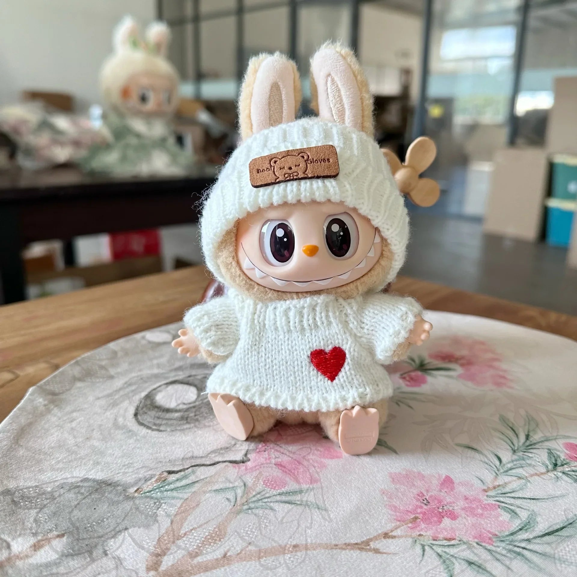 Cream Knit Heart Sweater on 17cm plush doll: cream cable-knit sweater dress, embroidered red heart on front.