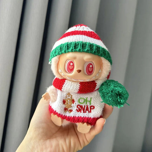 Holiday Sweater on 17cm plush doll: cream knit sweater with gingerbread man and "oh snap" text, red, white, and green stri...