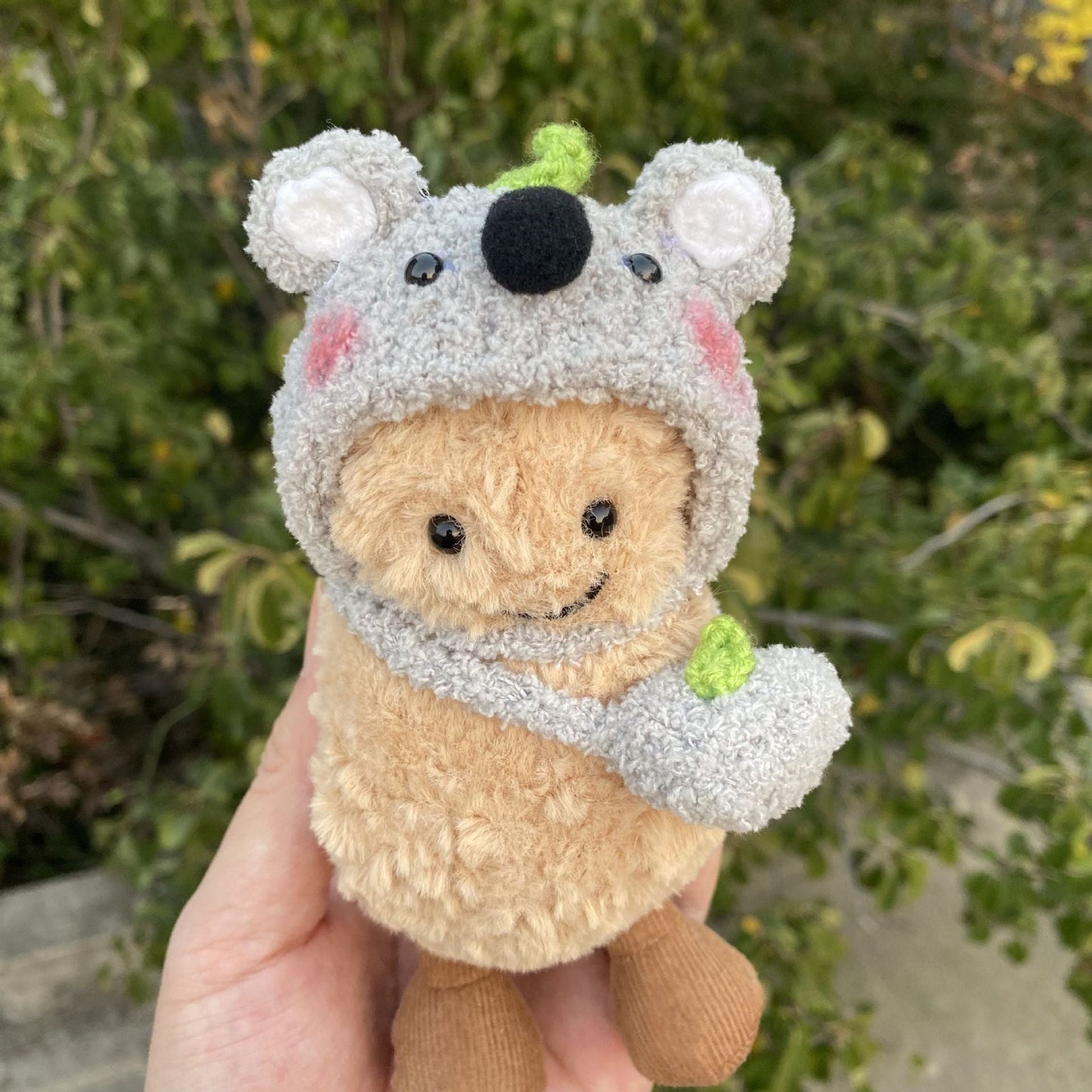 Koala Hood Outfit on 15cm plush doll: grey sherpa-textured koala hood with round white-trimmed ears, black felt nose and h...