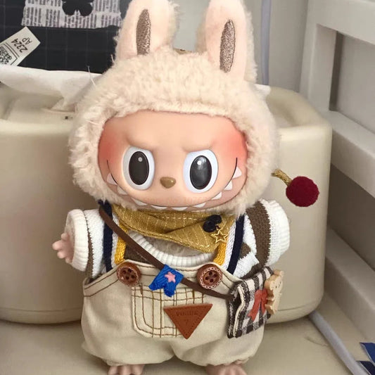 Vintage Street Outfit on 17cm plush doll: cream knit sweater with brown stripe accents, beige and brown plaid suspender ov...