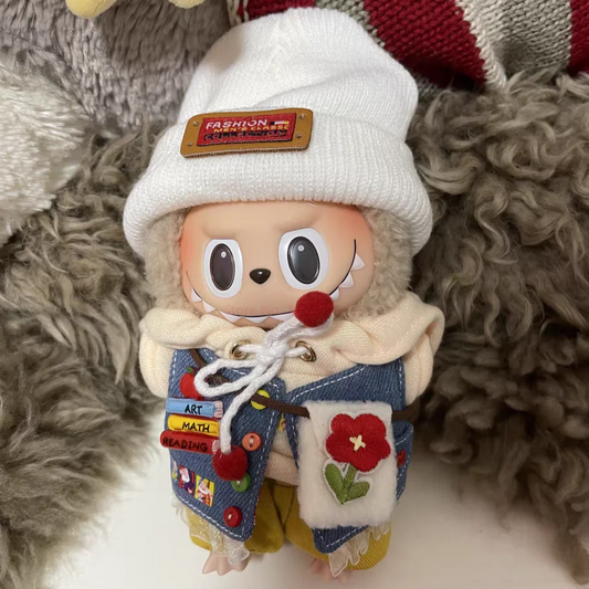 Market Day Outfit on 17cm plush doll: white knit beanie with woven "fashion" label, cream hoodie with drawstring detail.